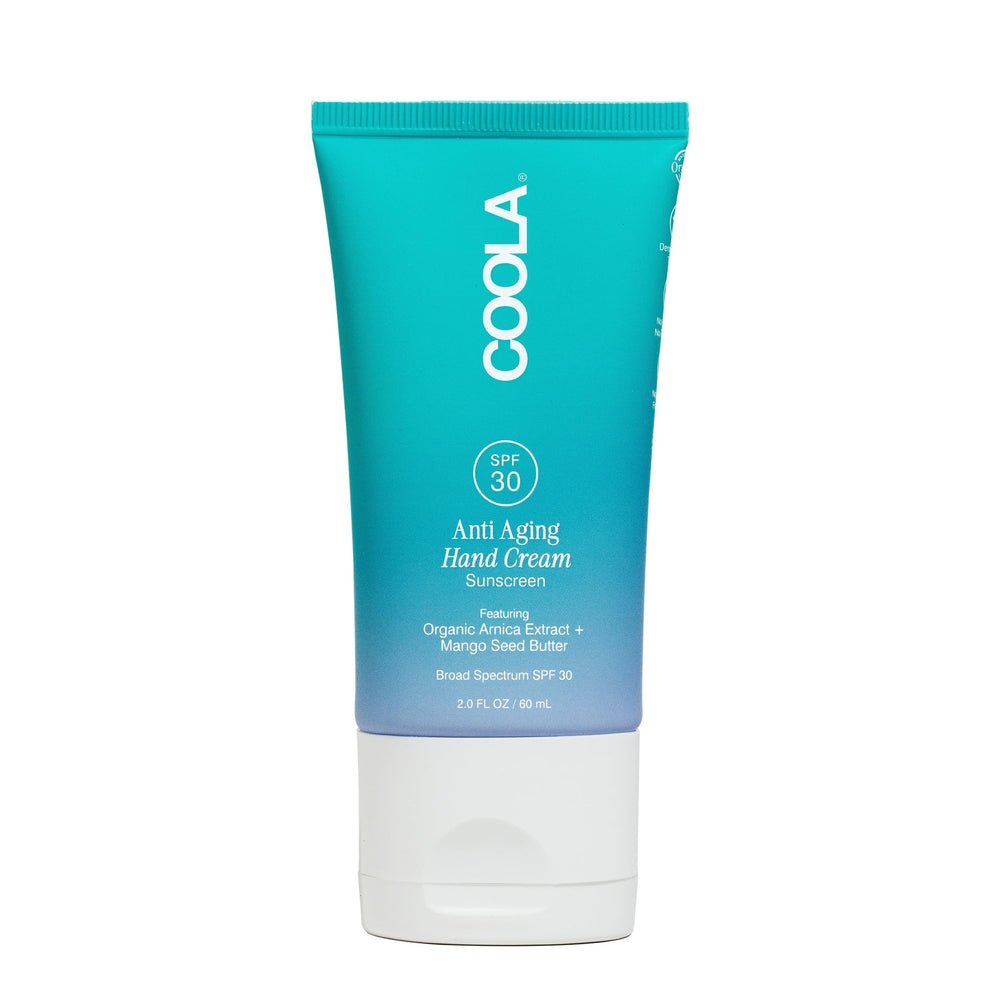 COOLA anti-aging hand cream jar close-up with mango seed butter for hydration