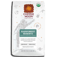 Copper Moon dark roast packaging showing Rainforest Reserve label for premium coffee.