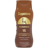 Coppertone Tanning Sunscreen Lotion SPF 15 bottle on a sunny beach for daily protection