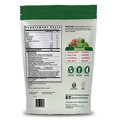 Country Farms Super Greens scoop mixing into water for a refreshing beverage.