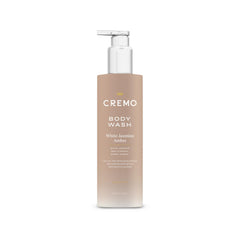 Cremo White Jasmine Amber bottle on shelf signals premium cleansing with evolving fragrance.