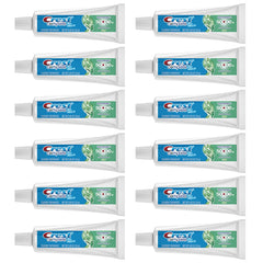 Crest Complete Whitening Scope toothpaste tube showing whitening and fresh breath benefits.