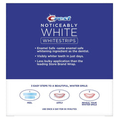 Crest Noticeably White Whitestrips strip aligned on teeth for noticeable whitening