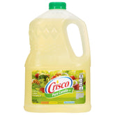 Crisco Pure Canola Oil 64oz bottle on a kitchen counter, ideal for frying and baking.