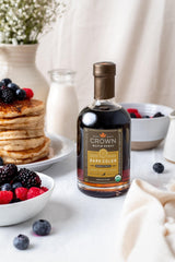 Crown Maple Dark syrup over pancakes captures premium indulgence and silky texture.