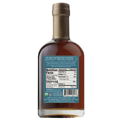 Crown Maple vanilla-infused syrup pouring glass shows aroma and drizzle perfect for pancakes and cocktails.