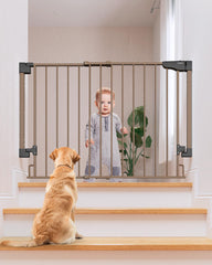 Cumbor stair gate mounted at top of stairs for safety.