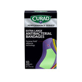 CURAD Performance extreme hold bandage close-up showing strong adhesive for active use