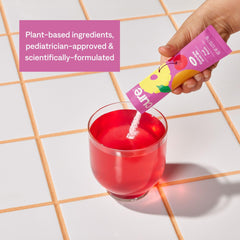 Cure Hydration powder dissolving in water for tasty kid-friendly hydration.