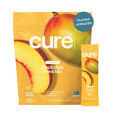 Cure Hydration peach mango packet close-up showing convenient sugar-free electrolyte mix