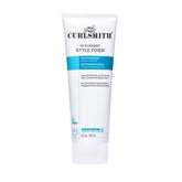 Curlsmith In-Shower Style Fixer bottle pour showing extreme hold for lasting curls.