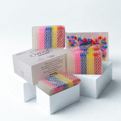 Cwise tall slim spiral candles on a cake for a refined look.