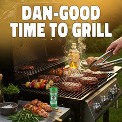 Dan-O's Butter Steak Seasoning bottle on the grill for summer steaks and vegetables.