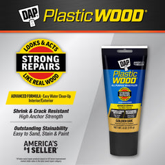 Close-up of applying DAP 582 with a spatula for wood repair.