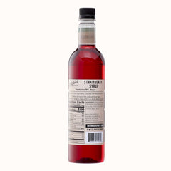 Pouring DaVinci Gourmet Naturals Strawberry Syrup over desserts