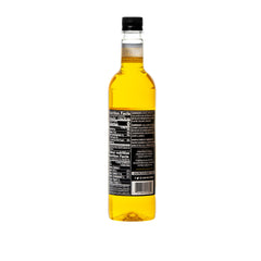 DaVinci Gourmet Sugar-Free Pineapple Syrup bottle being poured for hot or cold drinks