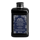Davines Heart of Glass bottle close-up showing silkening formula for blonde care.