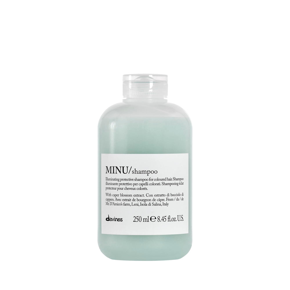 Davines MINU shampoo bottle closeup highlights color protection for treated hair.