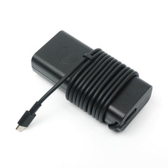Dell 65W USB-C charger side view, slim profile for storage.