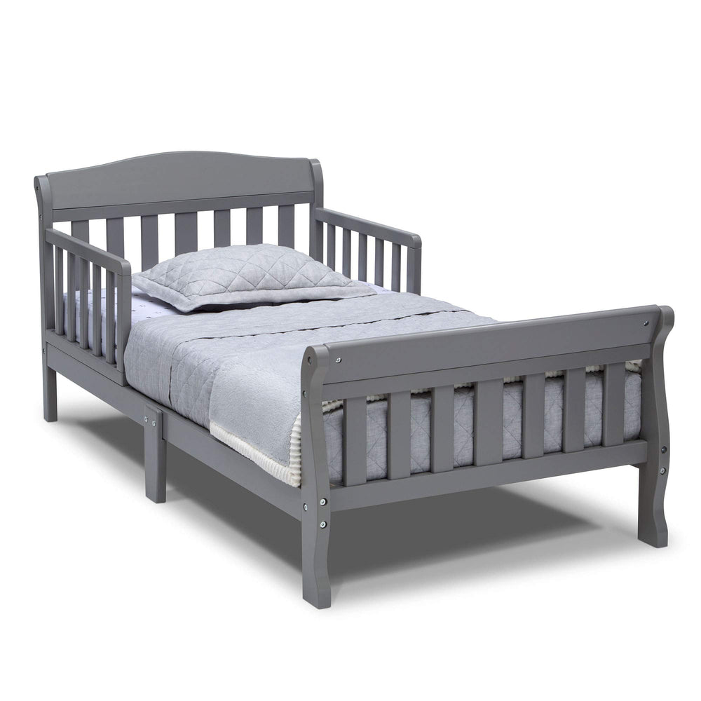 Delta Children Canton toddler bed grey front view shows sturdy wood construction for safe transition.