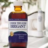 Dental Herb Under The Gums Irrigant bottle front for gum care, alcohol free