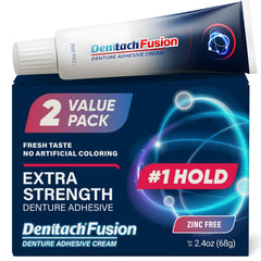DENTTACH Fusion denture adhesive tube being applied for secure hold.