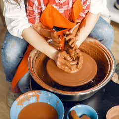 Deouss wheel-throwing clay action shot highlights smooth plasticity for precise forms.