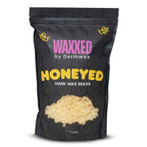 Dermwax WAXXED Honeyed hard wax beads jar front for professional salon use.