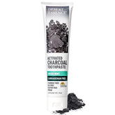 Desert Essence Activated Charcoal Toothpaste tube closeup highlighting brighter teeth