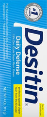 Desitin Daily Defense barrier application on baby skin demonstrates soothing care at first signs.