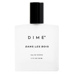 DIME Dans Les Bois bottle front view, bold woody floral fragrance for everyday wear