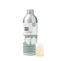 Dirty Labs Signature Scent bottle on shelf highlights compact, hyper-concentrated formula for fewer loads.