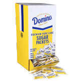 Domino sugar packets in dispenser box for quick self-serve sweetening.