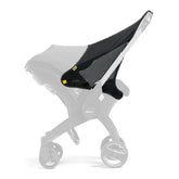 DOONA Sunshade Extension attached to a car seat for shade.