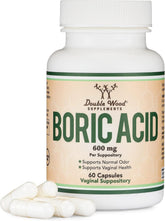 Double Wood Boric Acid Suppositories 60-count pack on a bathroom shelf for odor control