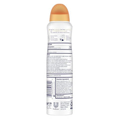 Dove Advanced Care Peach & Chamomile Tea spray bottle dispensing quickly dries on skin.