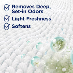 Downy Rinse beside baby clothes indicating skin-friendly formula.