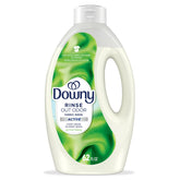 Downy Rinse bottle pour showing odor removal in one wash.