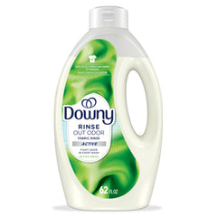 Downy Rinse bottle pour showing odor removal in one wash.