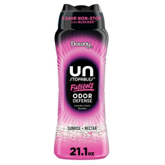 Downy Unstopables Fusions Sunrise Nectar beads bottle on a shelf with long-lasting scent.