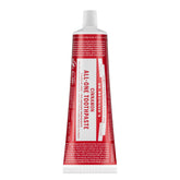 Dr. Bronner's All-One Cinnamon toothpaste tube closeup highlights natural whitening potential.