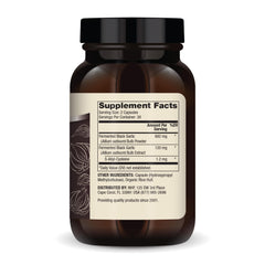 Close-up of Dr. Mercola Fermented Black Garlic capsules for convenient daily supplementation.