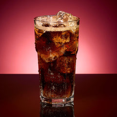 Dr Pepper Zero Strawberries and Cream pour into glass, showcasing smooth flavor.