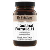Dr. Schulze's Intestinal Formula #1 bottle shown on a table, plant-based digestion support.