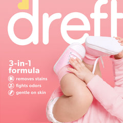 Dreft Stage 1 newborn onesie being washed for stain removal.
