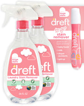 Dreft stain remover spray bottle on baby clothes, tackling tough stains.
