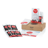 Dryel starter kit in a laundry setup showing suits and dresses for gentle steam cleaning