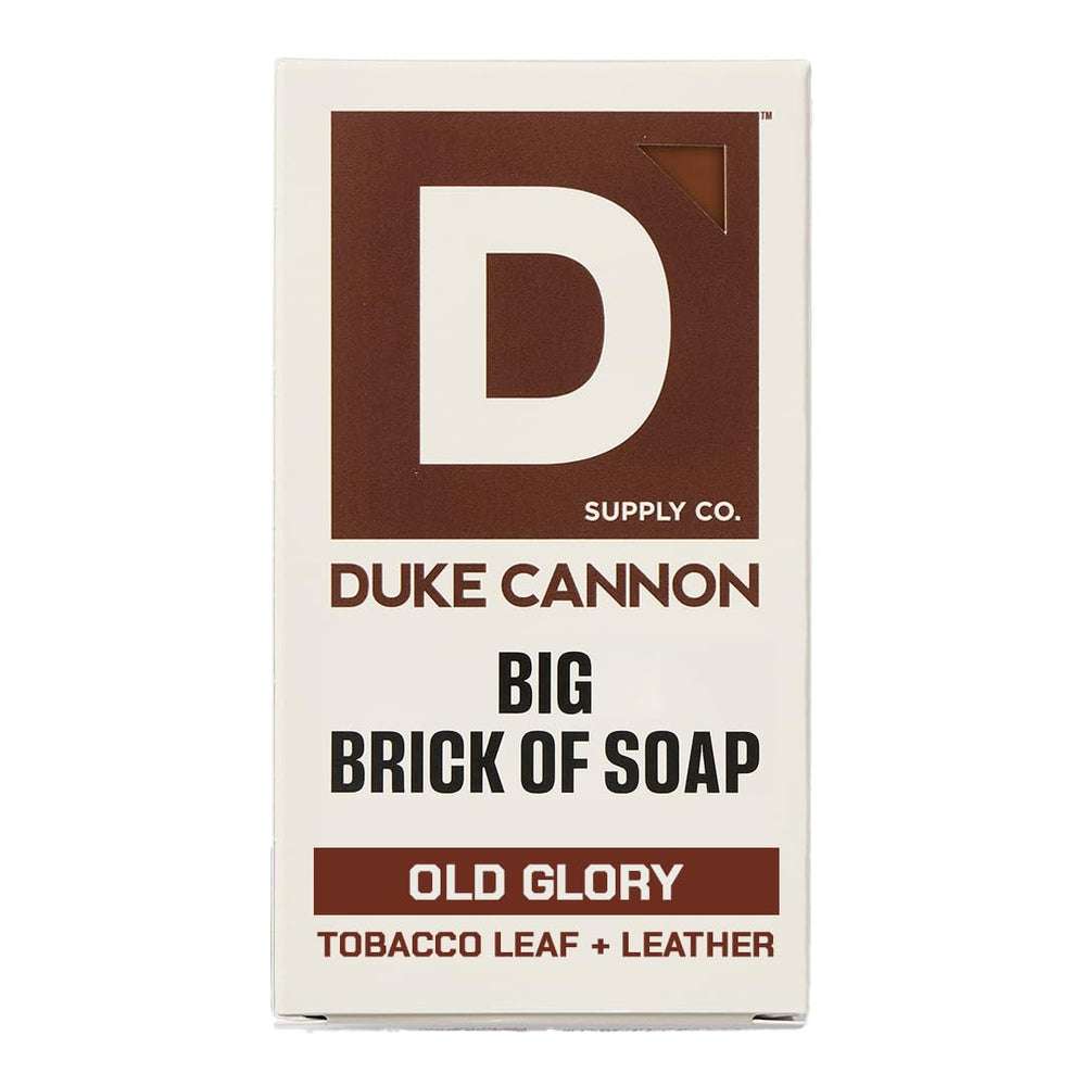 Duke Cannon Old Glory soap bar with leather and tobacco scent for long-lasting cleansing.