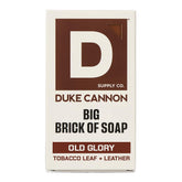 Duke Cannon Old Glory soap bar with leather and tobacco scent for long-lasting cleansing.