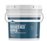 Earthborn Elements crushed red pepper flakes in a durable bucket for versatile use
